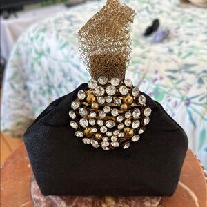 Elegant Black Clutch with Gold and Silver Accents